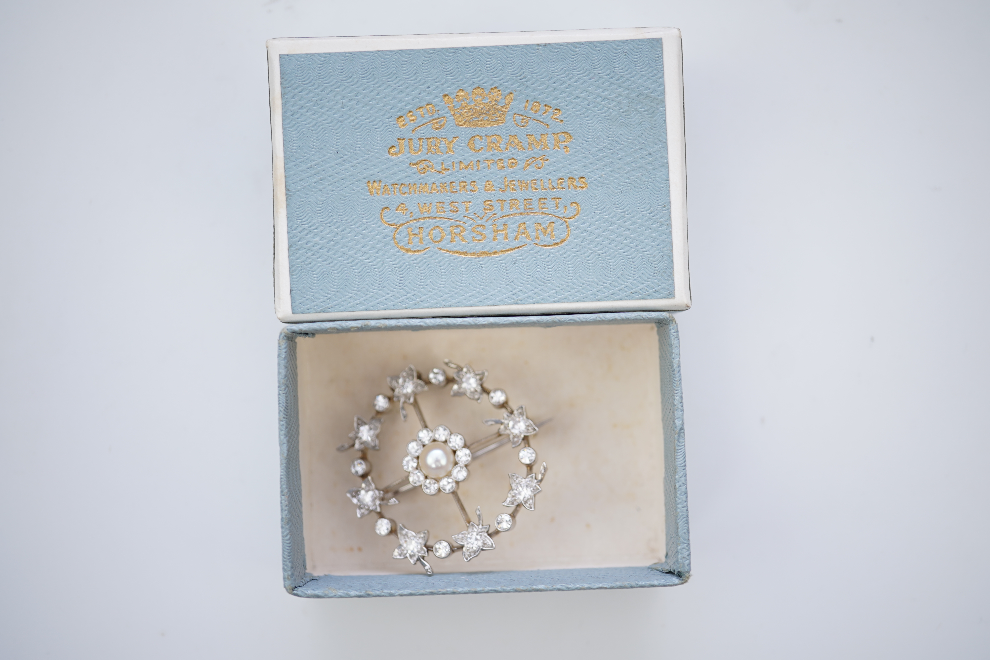 An attractive Edwardian pearl and diamond brooch, circa 1910